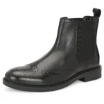 Three-quarter front view highlighting brogued toe and side profile of Vittorio Chelsea boot