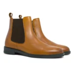 Paired Daniele Tan Chelsea Boots from Devogue Paris shown at an angle highlighting premium leather and Chelsea design