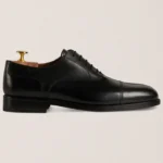 Devogue Paris black cap-toe Oxford shoes in full-grain leather