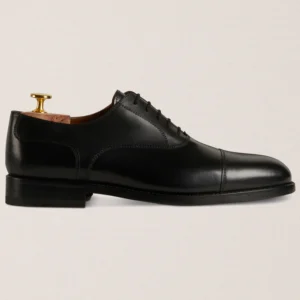Devogue Paris black cap-toe Oxford shoes in full-grain leather
